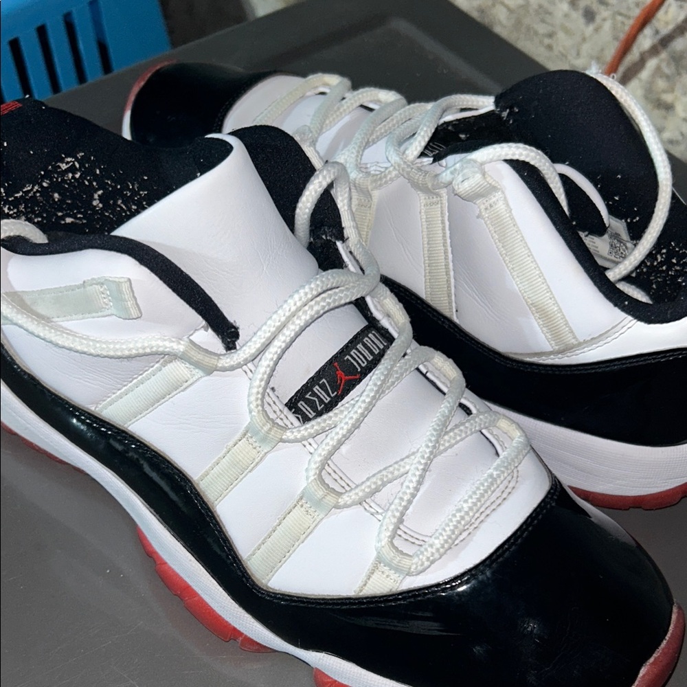 Black and White Sneakers with Red Accents